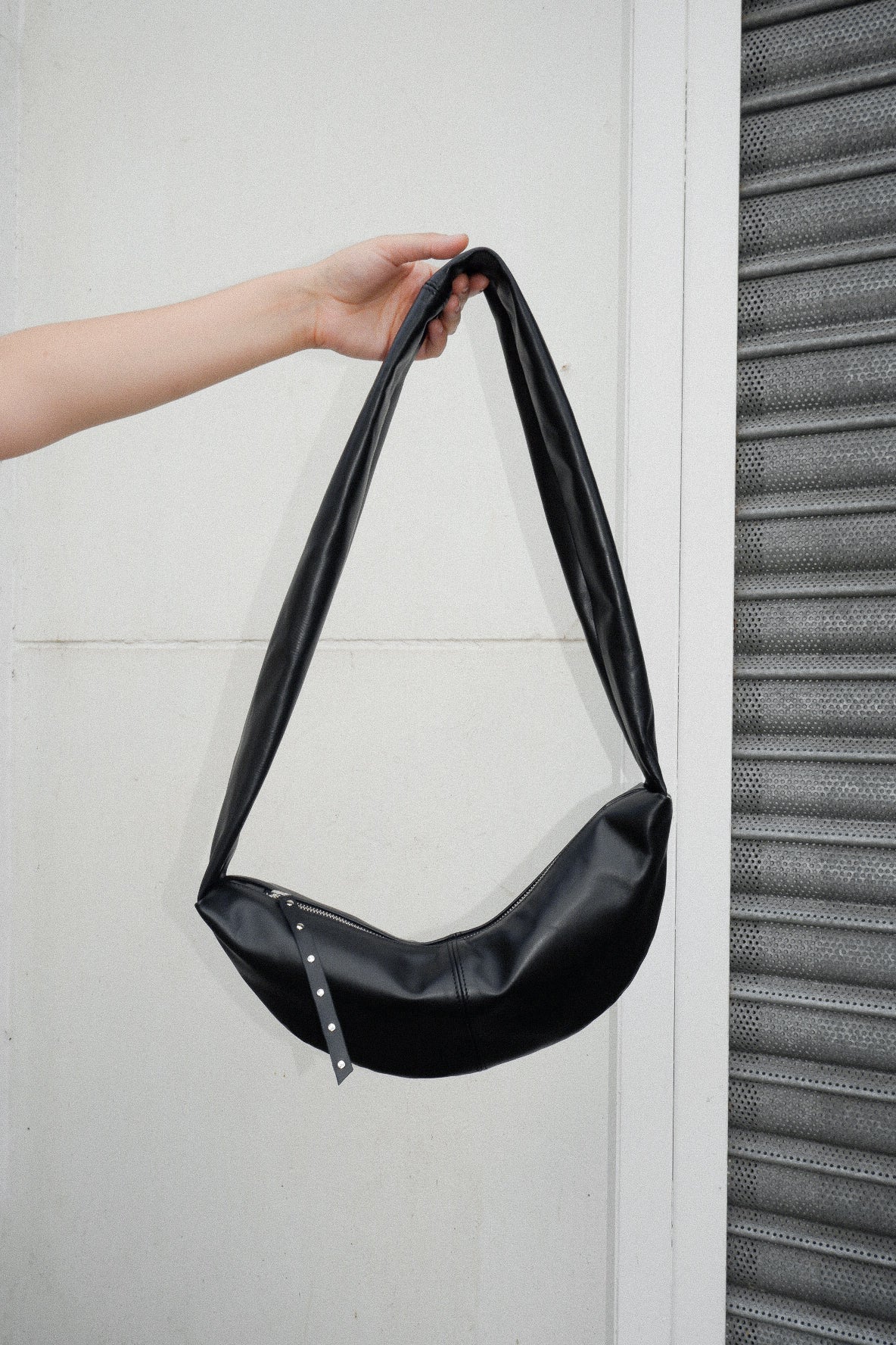 The Row | Slouchy banana small black shoulder bag | Savannahs